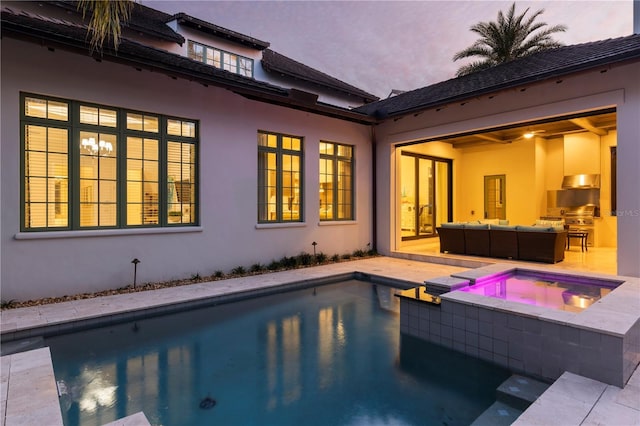 10143 Mattraw Pl, Golden Oak, FL 32836 - view of swimming pool featuring an outdoor hangout area, a pool with connected hot tub, a patio area, and area for grilling