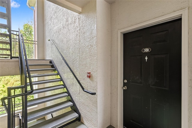 12843 Madison Pointe Unit 208, Orlando, FL 32821 - doorway to property with stucco siding
