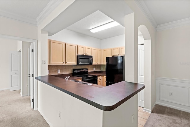 12843 Madison Pointe Unit 208, Orlando, FL 32821 - kitchen with black appliances, light brown cabinets, dark countertops, backsplash, and crown molding