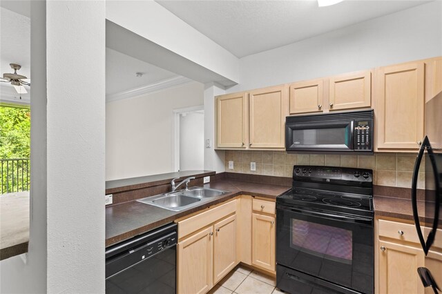 12843 Madison Pointe Unit 208, Orlando, FL 32821 - kitchen featuring black appliances, light brown cabinetry, dark countertops, decorative backsplash, and crown molding