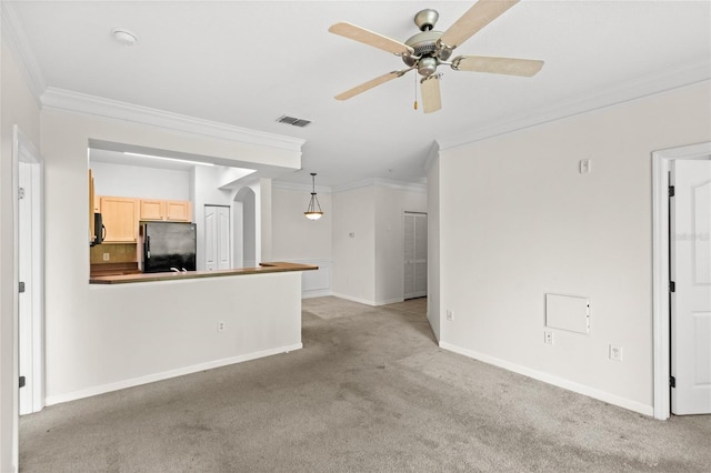12843 Madison Pointe Unit 208, Orlando, FL 32821 - unfurnished living room featuring crown molding, light colored carpet, and a ceiling fan
