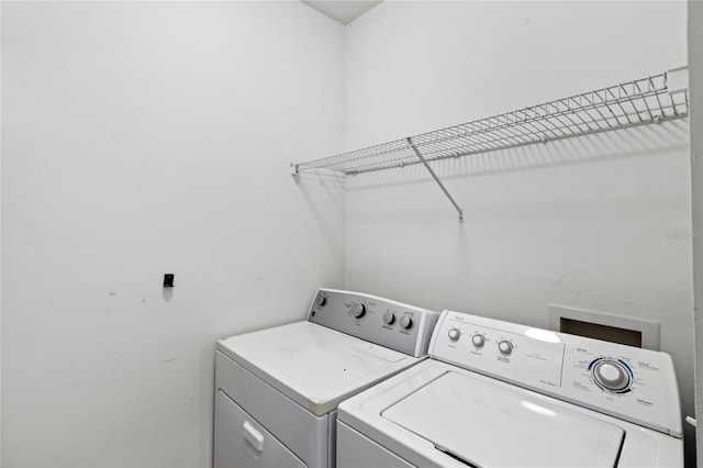 12843 Madison Pointe Unit 208, Orlando, FL 32821 - laundry room with separate washer and dryer