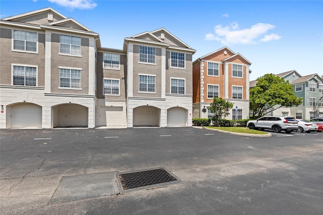 12843 Madison Pointe Unit 208, Orlando, FL 32821 - multi unit property featuring a garage and stucco siding