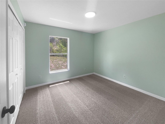 1877 Courtland Blvd, Deltona, FL 32738 - unfurnished bedroom featuring carpet and a closet
