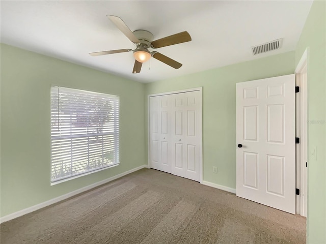 1877 Courtland Blvd, Deltona, FL 32738 - unfurnished bedroom featuring a closet, a ceiling fan, and carpet floors