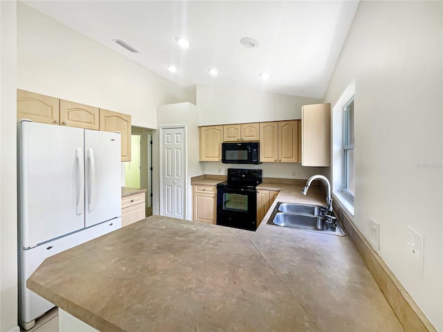 1877 Courtland Blvd, Deltona, FL 32738 - kitchen with black appliances, light brown cabinets, a peninsula, vaulted ceiling, and light countertops