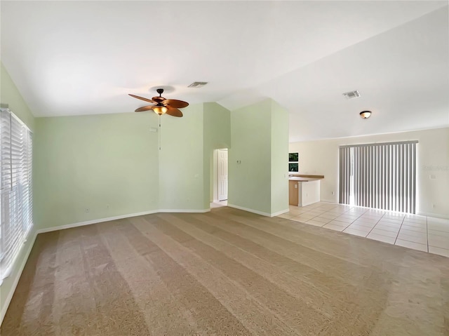 1877 Courtland Blvd, Deltona, FL 32738 - spare room featuring vaulted ceiling, a ceiling fan, and light colored carpet