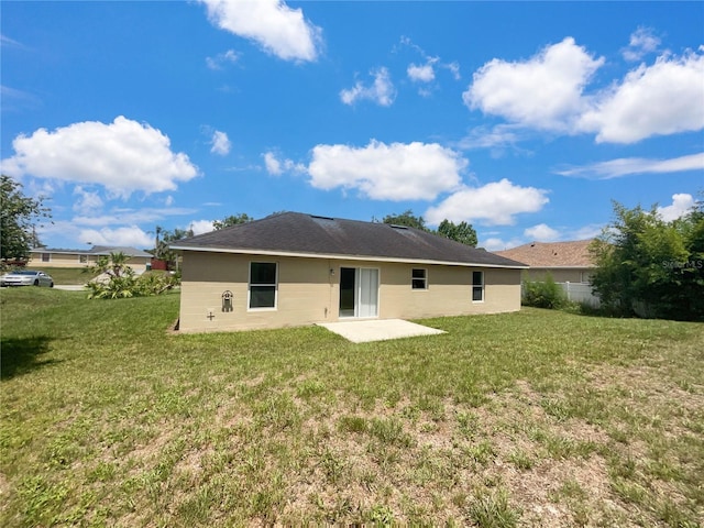 1877 Courtland Blvd, Deltona, FL 32738 - back of house featuring a yard and a patio area