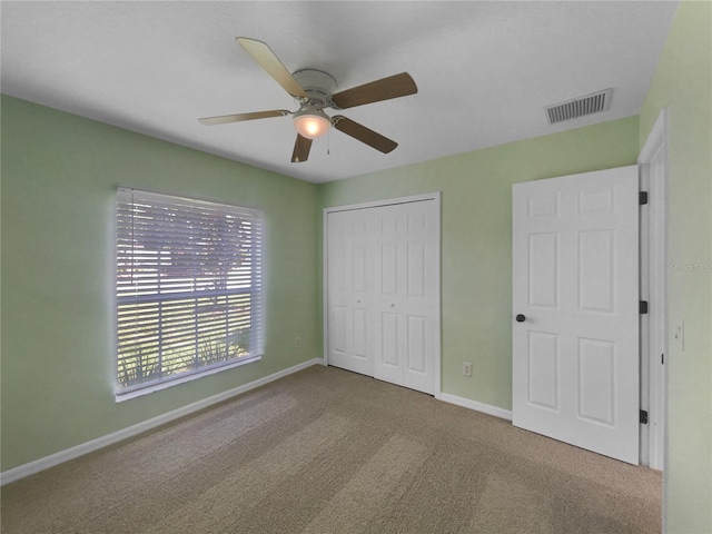 1877 Courtland Blvd, Deltona, FL 32738 - unfurnished bedroom with carpet floors, a closet, and a ceiling fan