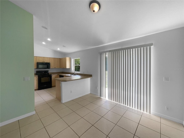 1877 Courtland Blvd, Deltona, FL 32738 - kitchen featuring black appliances, light brown cabinetry, a peninsula, light tile patterned flooring, and lofted ceiling