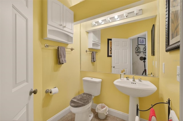 5704 Bay Side Dr, Orlando, FL 32819 - bathroom featuring toilet and a sink