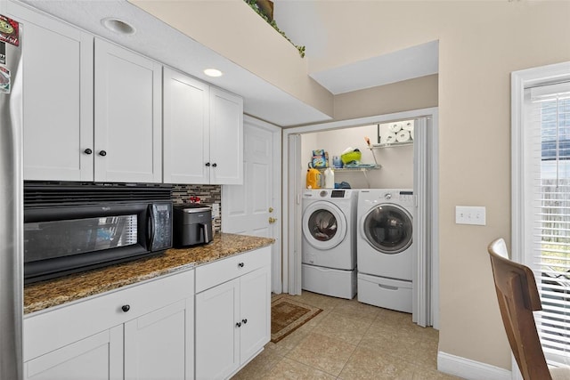 5704 Bay Side Dr, Orlando, FL 32819 - washroom featuring washing machine and clothes dryer and healthy amount of natural light
