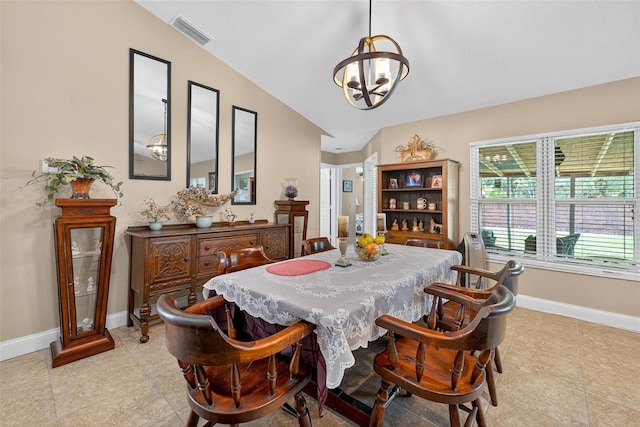 5704 Bay Side Dr, Orlando, FL 32819 - dining room with a chandelier, lofted ceiling, and light tile patterned floors