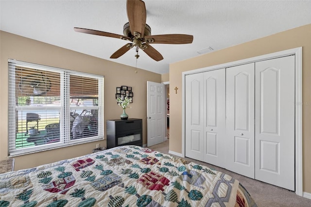 5704 Bay Side Dr, Orlando, FL 32819 - bedroom with carpet flooring, a closet, and ceiling fan