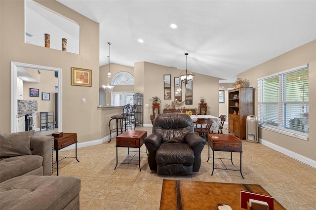 5704 Bay Side Dr, Orlando, FL 32819 - living area featuring a chandelier, vaulted ceiling, recessed lighting, and light tile patterned floors