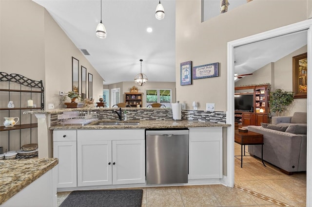 5704 Bay Side Dr, Orlando, FL 32819 - kitchen with dishwasher, white cabinetry, light stone countertops, open floor plan, and pendant lighting