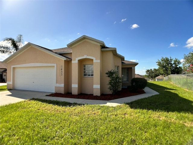 1433 Bluff Loop, Dundee, FL 33838 - mediterranean / spanish home featuring a garage, stucco siding, and concrete driveway
