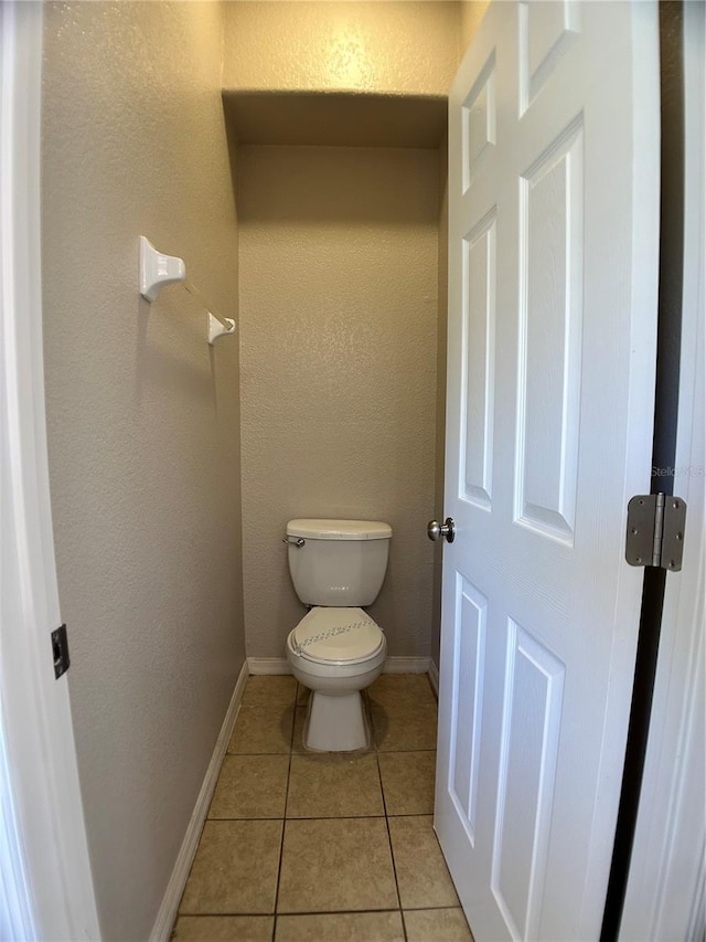 1433 Bluff Loop, Dundee, FL 33838 - bathroom featuring tile patterned floors and toilet