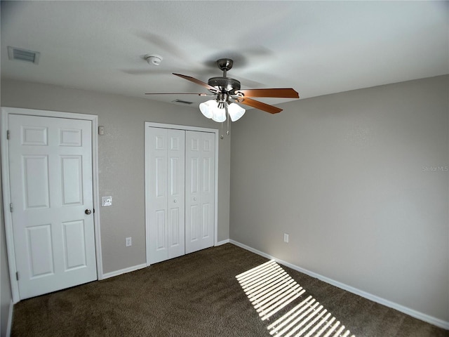 1433 Bluff Loop, Dundee, FL 33838 - unfurnished bedroom featuring carpet floors, a closet, and ceiling fan