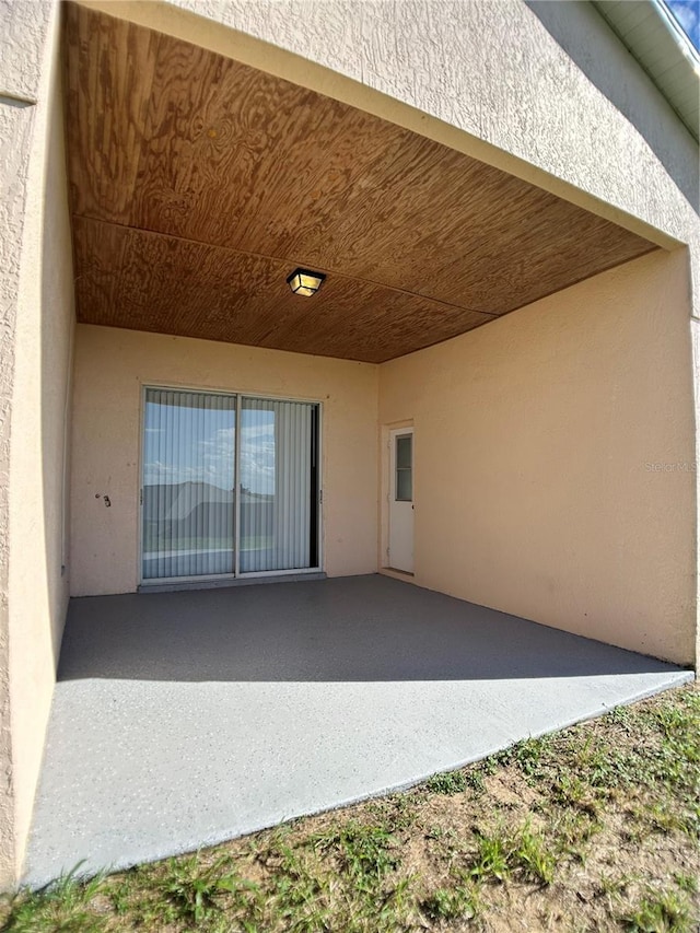 1433 Bluff Loop, Dundee, FL 33838 - view of patio / terrace featuring a carport