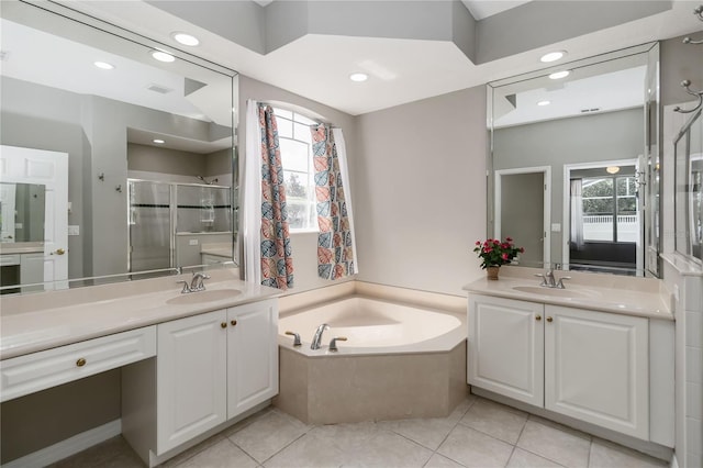 2865 Ashton Ter, Oviedo, FL 32765 - bathroom with two vanities, a garden tub, a shower stall, recessed lighting, and tile patterned flooring