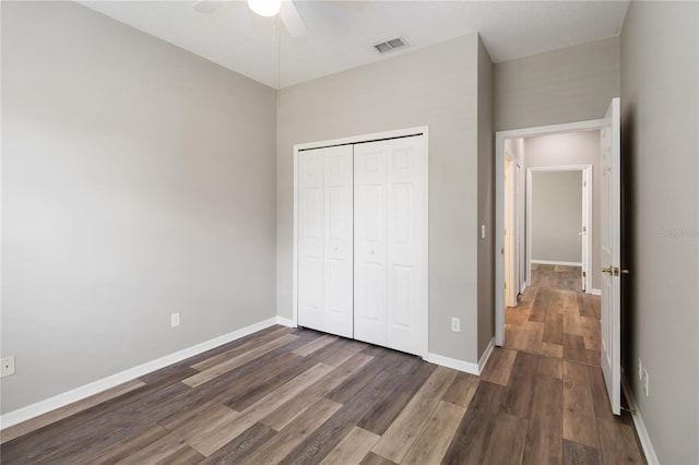 2865 Ashton Ter, Oviedo, FL 32765 - unfurnished bedroom with dark wood-style flooring, a closet, and ceiling fan
