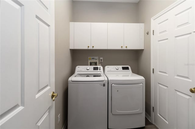 2865 Ashton Ter, Oviedo, FL 32765 - laundry area featuring cabinet space and washer and dryer