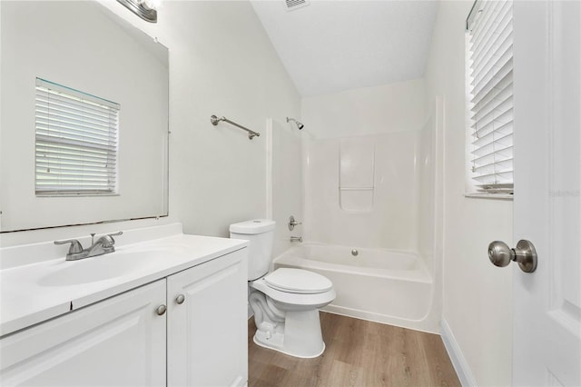 9558 Lupine Ave, Orlando, FL 32824 - bathroom with wood finished floors, vanity, and shower / bath combination