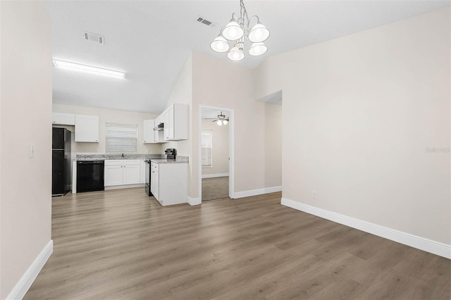 9558 Lupine Ave, Orlando, FL 32824 - unfurnished living room with light wood-type flooring, a chandelier, ceiling fan, and high vaulted ceiling
