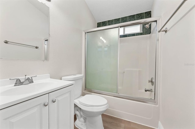 9558 Lupine Ave, Orlando, FL 32824 - full bath with vanity, enclosed tub / shower combo, and wood finished floors