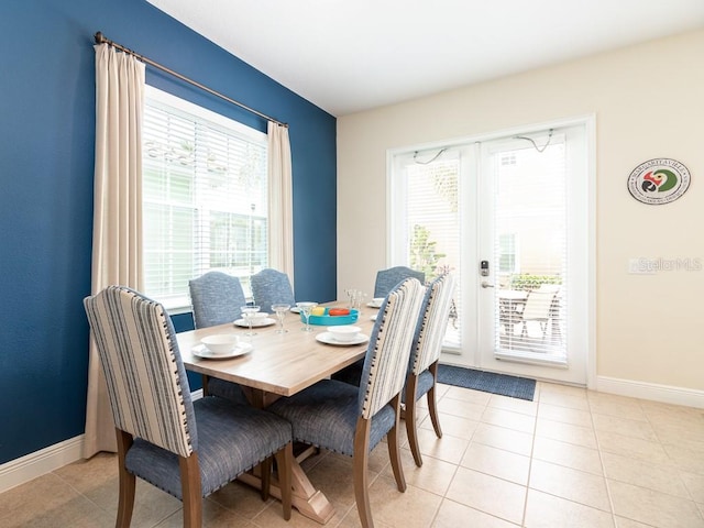 3004 Latitude Ln, Kissimmee, FL 34747 - dining area with baseboards and light tile patterned floors