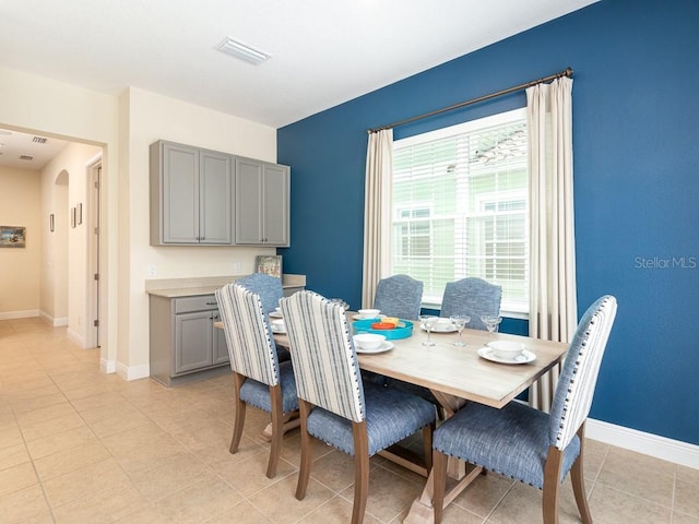3004 Latitude Ln, Kissimmee, FL 34747 - dining area with baseboards and light tile patterned floors