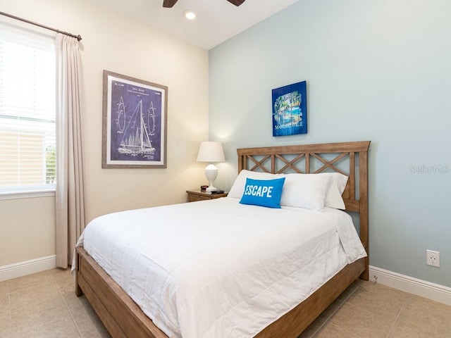 3004 Latitude Ln, Kissimmee, FL 34747 - tiled bedroom featuring a ceiling fan and recessed lighting