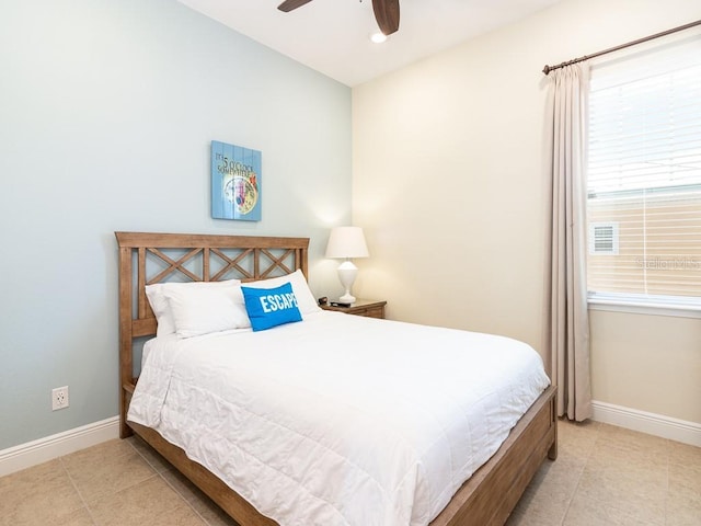 3004 Latitude Ln, Kissimmee, FL 34747 - tiled bedroom with baseboards and ceiling fan