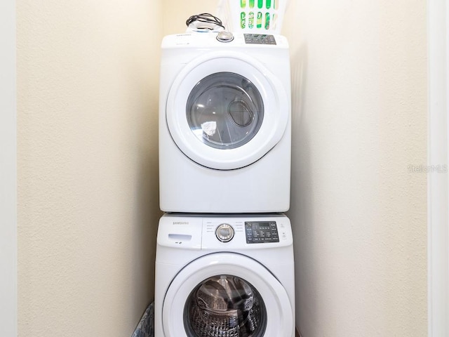 3004 Latitude Ln, Kissimmee, FL 34747 - laundry area with stacked washer and clothes dryer