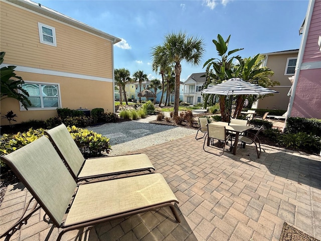 3004 Latitude Ln, Kissimmee, FL 34747 - view of patio / terrace with outdoor dining space and a residential view