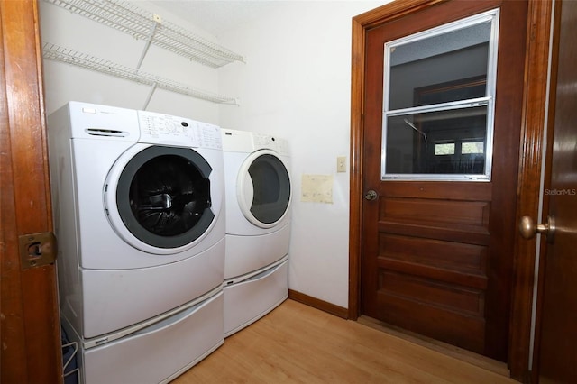 1121 Winged Foot Cir, Winter Springs, FL 32708 - laundry room featuring washer and clothes dryer and light wood-style flooring