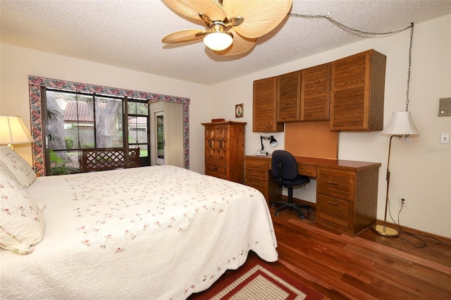 1121 Winged Foot Cir, Winter Springs, FL 32708 - bedroom with dark wood finished floors, a desk, a ceiling fan, access to exterior, and a textured ceiling