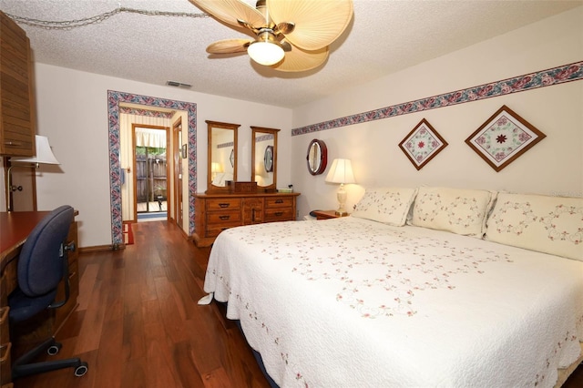 1121 Winged Foot Cir, Winter Springs, FL 32708 - bedroom with dark wood finished floors, ceiling fan, and a textured ceiling