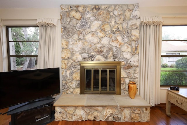 1121 Winged Foot Cir, Winter Springs, FL 32708 - detailed view of wood finished floors and a stone fireplace