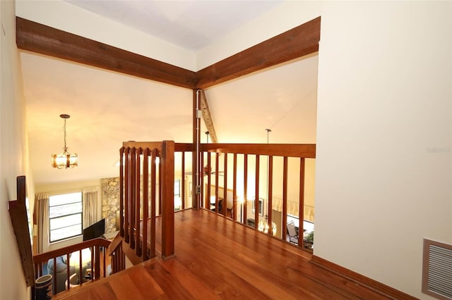 1121 Winged Foot Cir, Winter Springs, FL 32708 - hall with a chandelier, an upstairs landing, and wood finished floors