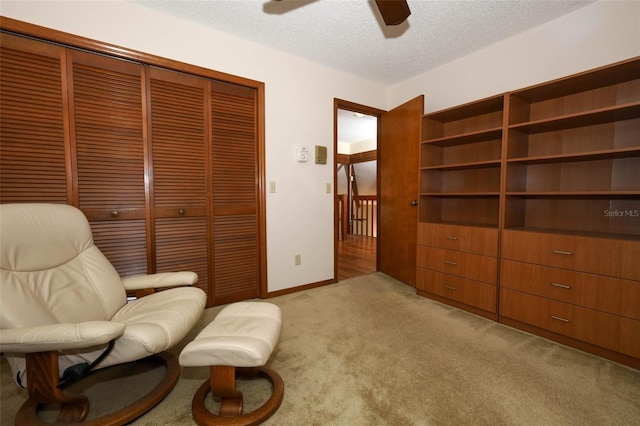 1121 Winged Foot Cir, Winter Springs, FL 32708 - living area featuring carpet, ceiling fan, and a textured ceiling
