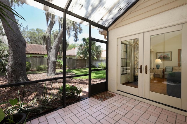1121 Winged Foot Cir, Winter Springs, FL 32708 - unfurnished sunroom featuring vaulted ceiling and french doors