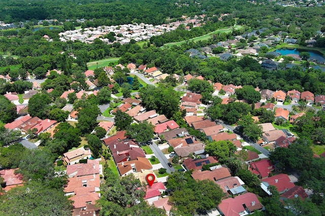 1121 Winged Foot Cir, Winter Springs, FL 32708 - aerial overview of property's location with nearby suburban area and a nearby body of water