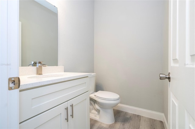bathroom featuring vanity and wood finished floors