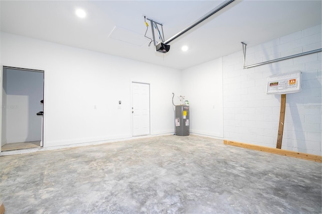 garage featuring a garage door opener, electric water heater, and recessed lighting