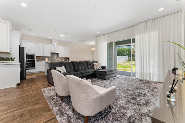 15716 Sweet Lemon Way, Winter Garden, FL 34787 - living area featuring dark wood-style floors and recessed lighting