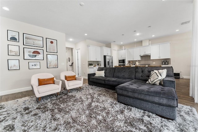 15716 Sweet Lemon Way, Winter Garden, FL 34787 - living area featuring wood finished floors and recessed lighting