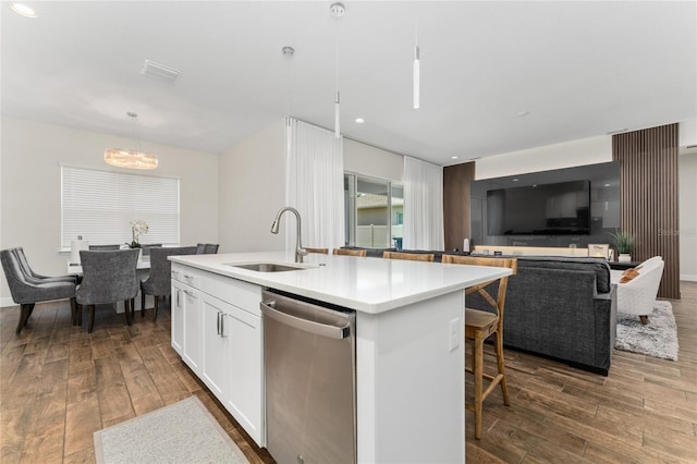 15716 Sweet Lemon Way, Winter Garden, FL 34787 - kitchen with stainless steel dishwasher, dark wood-style floors, a chandelier, white cabinetry, and recessed lighting