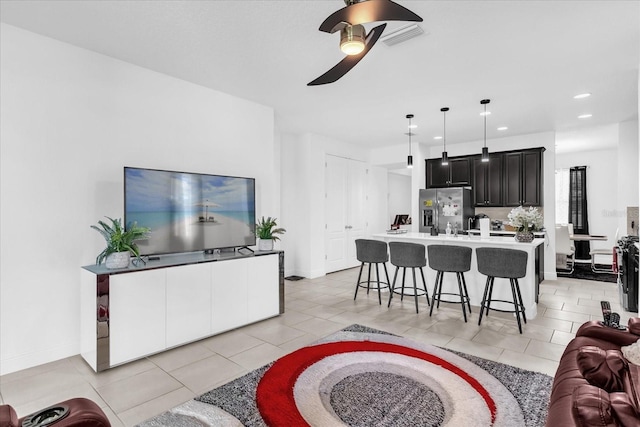 1156 Cavender Creek Rd, Minneola, FL 34715 - living room featuring ceiling fan, light tile patterned floors, and recessed lighting